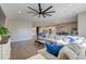 Open-concept living room with hardwood floors, a ceiling fan, and a view of the kitchen and dining area at 315 Silent Bluff Dr, Summerville, SC 29486