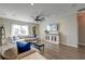 Spacious living room with hardwood floors, a cozy sectional sofa, and a large TV for Gathering entertainment at 315 Silent Bluff Dr, Summerville, SC 29486