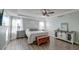 Tranquil main bedroom with tray ceilings, ceiling fan, and hardwood style flooring at 315 Silent Bluff Dr, Summerville, SC 29486