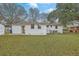 A large backyard showing the home's exterior, with a shed and a central AC, offering an open canvas for outdoor living at 337 Cessna Ave, Charleston, SC 29407