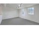 Finished basement with two windows, neutral carpet and a modern spotlight lighting fixture at 337 Cessna Ave, Charleston, SC 29407