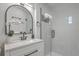 Bright bathroom featuring a modern vanity, granite countertop, an arch mirror and a glass-enclosed shower at 337 Cessna Ave, Charleston, SC 29407