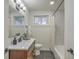Bathroom featuring a vanity, toilet, and tub with shower head and window at 337 Cessna Ave, Charleston, SC 29407