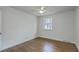 Bedroom with hardwood floors, a ceiling fan, and a window providing natural light at 337 Cessna Ave, Charleston, SC 29407