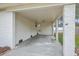 A well-lit, covered carport area with painted brick walls and a concrete floor provides convenient parking and shelter at 337 Cessna Ave, Charleston, SC 29407