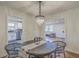 Open concept dining room with stylish decor and views of the kitchen and living room at 337 Cessna Ave, Charleston, SC 29407