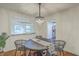 Chic dining room with decorative chandelier, table setting, and view to the kitchen at 337 Cessna Ave, Charleston, SC 29407