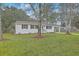 Lovely home with a carport surrounded by mature trees and lush greenery at 337 Cessna Ave, Charleston, SC 29407