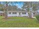 Charming white brick home with a lush front lawn and classic black shutters at 337 Cessna Ave, Charleston, SC 29407