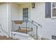 Cozy entryway featuring a decorative front door, black railing, and brick detailing at 337 Cessna Ave, Charleston, SC 29407