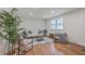 Light and airy living room with hardwood floors, minimalist decor, and ample space at 337 Cessna Ave, Charleston, SC 29407
