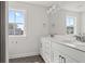 Bathroom with double vanity, white cabinets, and a large window showcasing the view at 346 Hillman Trail Dr, Moncks Corner, SC 29461