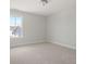 Empty bedroom with neutral carpet and paint, featuring a single window at 346 Hillman Trail Dr, Moncks Corner, SC 29461