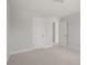 Bedroom with neutral carpet and paint and an adjoining room visible through the open door at 346 Hillman Trail Dr, Moncks Corner, SC 29461
