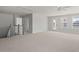 Large bonus room with neutral carpet, a ceiling fan, and access to the outside at 346 Hillman Trail Dr, Moncks Corner, SC 29461