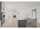 Open concept kitchen with island and stainless steel appliances offering views of the living room at 346 Hillman Trail Dr, Moncks Corner, SC 29461