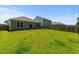 Expansive backyard with a well-maintained lawn, trees and views of surrounding houses at 350 Bering Ln, Summerville, SC 29486