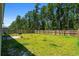 Large fenced backyard with a green lawn and a patio area, perfect for outdoor entertaining at 350 Bering Ln, Summerville, SC 29486
