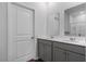 Bright bathroom featuring a double sink vanity with gray cabinets and a framed mirror at 350 Bering Ln, Summerville, SC 29486