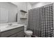 Bathroom featuring a shower with a black and white gingham shower curtain and floating shelves at 350 Bering Ln, Summerville, SC 29486