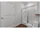 Bathroom featuring a glass enclosed shower, tile surround, and wood look flooring at 350 Bering Ln, Summerville, SC 29486