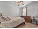 Cozy bedroom with a ceiling fan, dresser, and comfortable bed with patterned bedding at 350 Bering Ln, Summerville, SC 29486