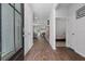 Inviting home entryway with wood-look floors, neutral walls, and views of the living spaces and main bedroom at 350 Bering Ln, Summerville, SC 29486