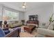 Spacious living room with contemporary decor, cozy seating, and a large flat-screen TV at 350 Bering Ln, Summerville, SC 29486