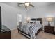 Cozy main bedroom with a comfortable bed, ceiling fan, and access to the en-suite bathroom at 350 Bering Ln, Summerville, SC 29486