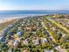 Expansive aerial view of a charming coastal community with stunning ocean and golf course views at 3619 Loggerhead Ct, Seabrook Island, SC 29455