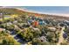Aerial view of a coastal neighborhood showing proximity to beach and golf course at 3619 Loggerhead Ct, Seabrook Island, SC 29455