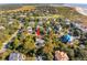 Aerial view of a charming home surrounded by lush greenery in a coastal neighborhood with golf nearby at 3619 Loggerhead Ct, Seabrook Island, SC 29455