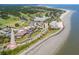 Stunning aerial view of a coastal community featuring golf course, homes, beach, and ocean at 3619 Loggerhead Ct, Seabrook Island, SC 29455