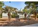 Backyard view of a home with a deck and palm trees at 3619 Loggerhead Ct, Seabrook Island, SC 29455