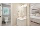 Bright bathroom with white vanity, neutral walls, and tile flooring at 3619 Loggerhead Ct, Seabrook Island, SC 29455