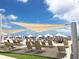 Beach umbrellas and seating on the beach on a beautiful sunny day with clear blue skies at 3619 Loggerhead Ct, Seabrook Island, SC 29455