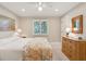 Inviting bedroom with a floral quilt, window, and wooden dresser at 3619 Loggerhead Ct, Seabrook Island, SC 29455