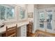 Bright desk and work space features white cabinets, and tile counter tops with natural light at 3619 Loggerhead Ct, Seabrook Island, SC 29455