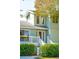 Exterior angle of two-story home featuring a white porch and green shrubbery at 3619 Loggerhead Ct, Seabrook Island, SC 29455