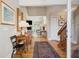 Elegant foyer with hardwood floors, a vintage rug, and an open view into the living room at 3619 Loggerhead Ct, Seabrook Island, SC 29455