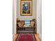 Hallway with a wooden bench, bags, and decorative artwork at 3619 Loggerhead Ct, Seabrook Island, SC 29455