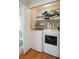 Laundry room equipped with modern washer and dryer, and shelving for supplies at 3619 Loggerhead Ct, Seabrook Island, SC 29455