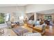 Spacious living room with vaulted ceilings, a cozy seating area, hardwood floors, and access to other rooms in the house at 3619 Loggerhead Ct, Seabrook Island, SC 29455