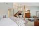 Spacious main bedroom boasting a four-poster bed and natural light at 3619 Loggerhead Ct, Seabrook Island, SC 29455
