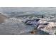 An eye-level shot features three friendly dolphins playing near the shore's edge at 3619 Loggerhead Ct, Seabrook Island, SC 29455