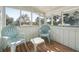 Cozy patio with blue chairs and wooded views at 3619 Loggerhead Ct, Seabrook Island, SC 29455