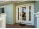 Close up of the front door on a porch with a green lawn at 3619 Loggerhead Ct, Seabrook Island, SC 29455