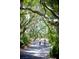 Three women enjoy bike riding in a wooded, landscaped area within the community at 3619 Loggerhead Ct, Seabrook Island, SC 29455