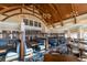 Stylish restaurant features booth seating, wooden tables, and a view of a well-lit dining space at 3619 Loggerhead Ct, Seabrook Island, SC 29455