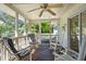 Relaxing screened porch with comfortable seating, and views of the yard at 3619 Loggerhead Ct, Seabrook Island, SC 29455